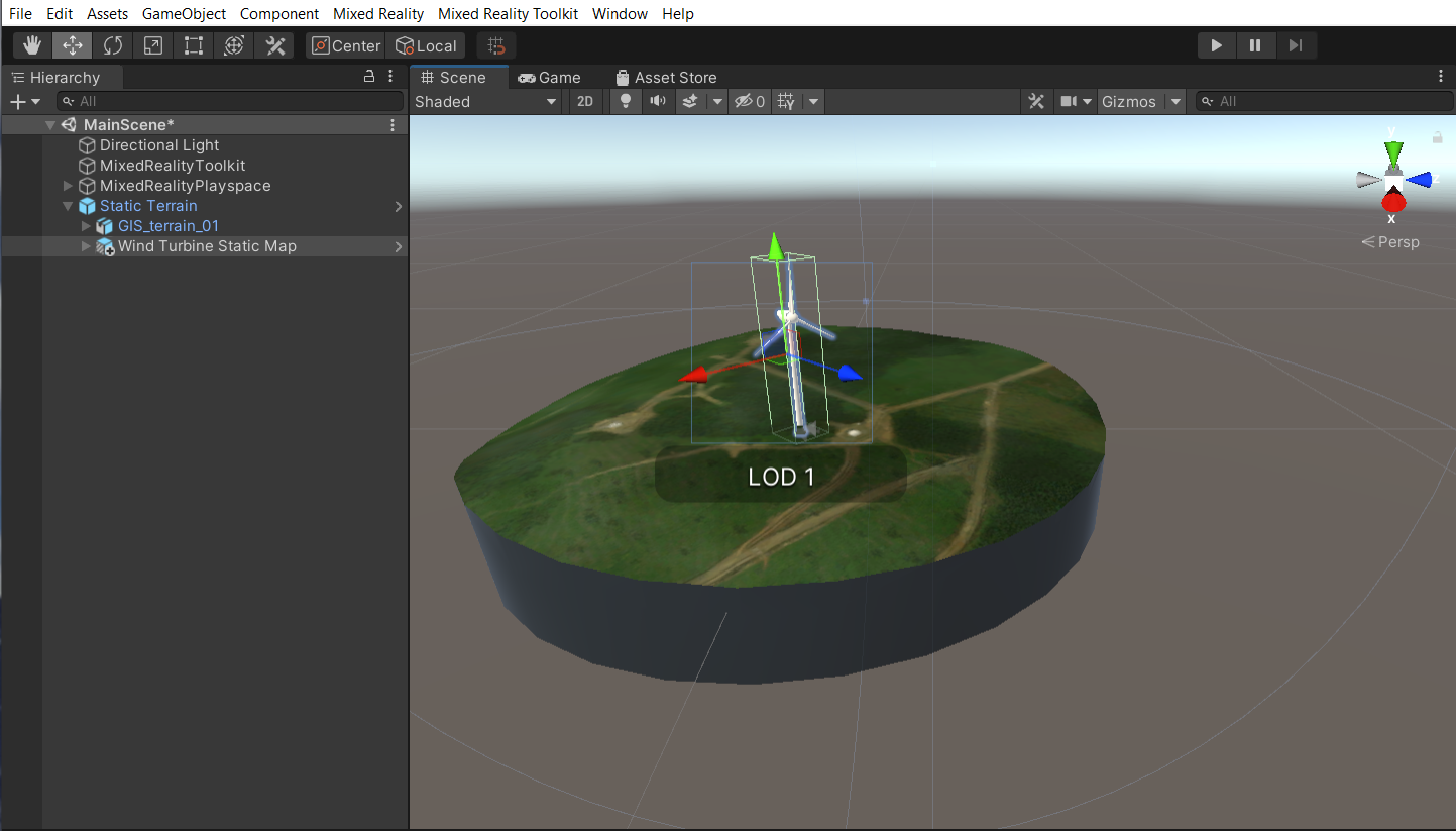 Snímek obrazovky okna scény Unity se zvýrazněnou hlavní scénou a statickým mapovým objektem a nástrojem pro škálování větrné turbíny