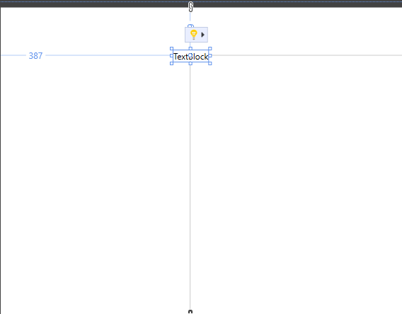 snímek obrazovky ovládacího prvku TextBlock na návrhové ploše. Zobrazí se pokyny pro umístění a změnu velikosti ovládacího prvku.