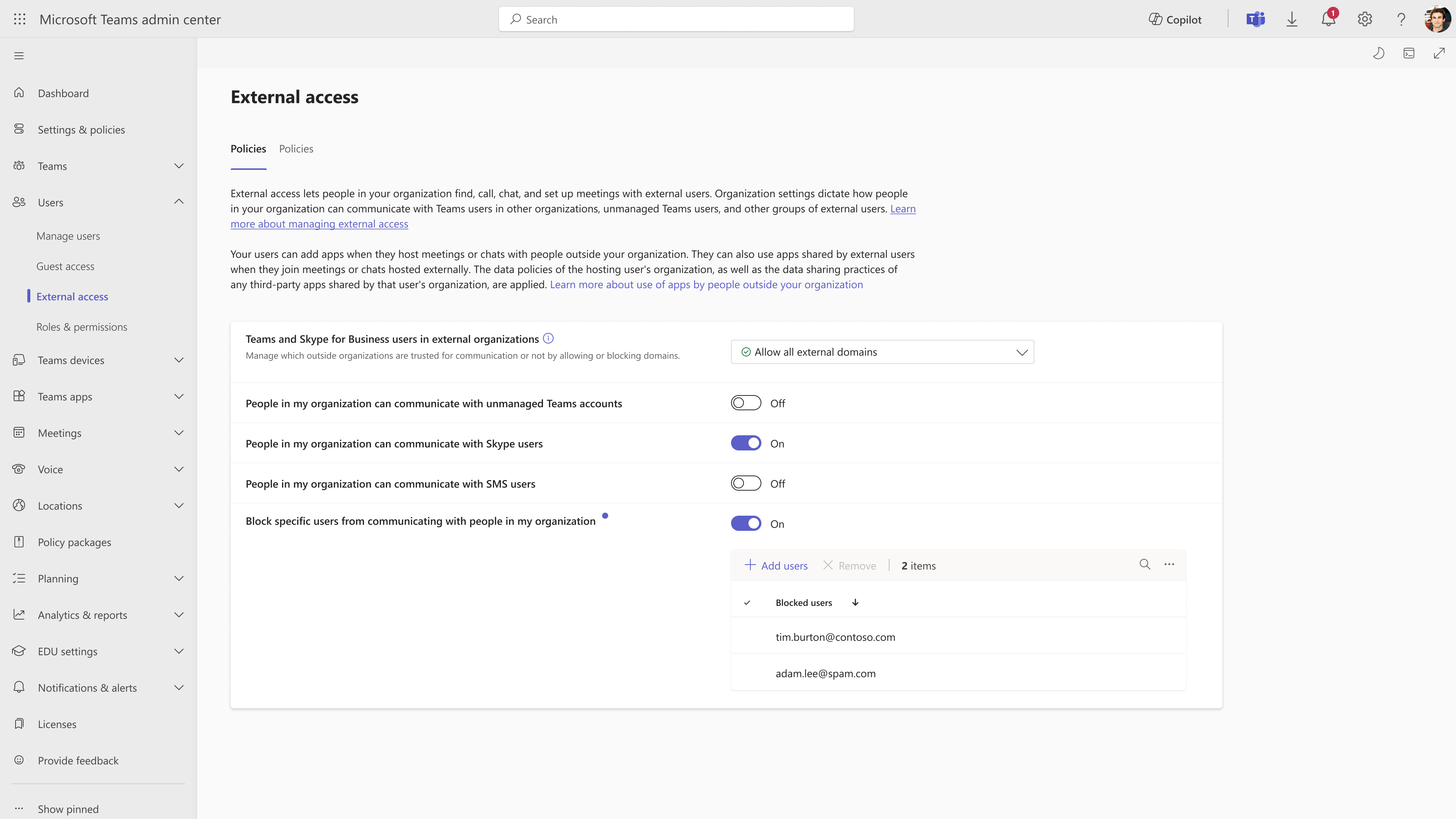 A screenshot of the External Users page with the Add users section displaying the emails of blocked users, and the Add users option available to add more emails.