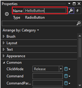 Screenshot of the Properties window for a RadioButton control with the value of the Name property changed to HelloButton.