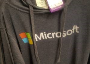 Photograph of a gray sweatshirt with a Microsoft label and logo.