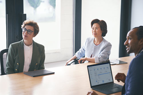 Photograph showing people meeting in a conference room.