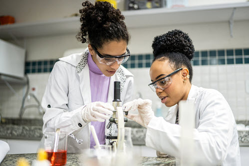 Photograph showing researchers working in a lab.