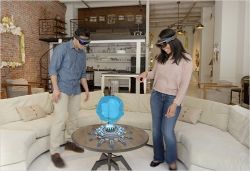 Man and women with holograph on table