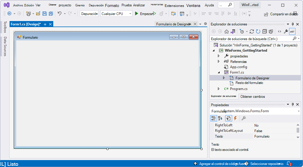 La ventana de Visual Studio, que muestra el proyecto de línea base WinForms y un Forms Designer