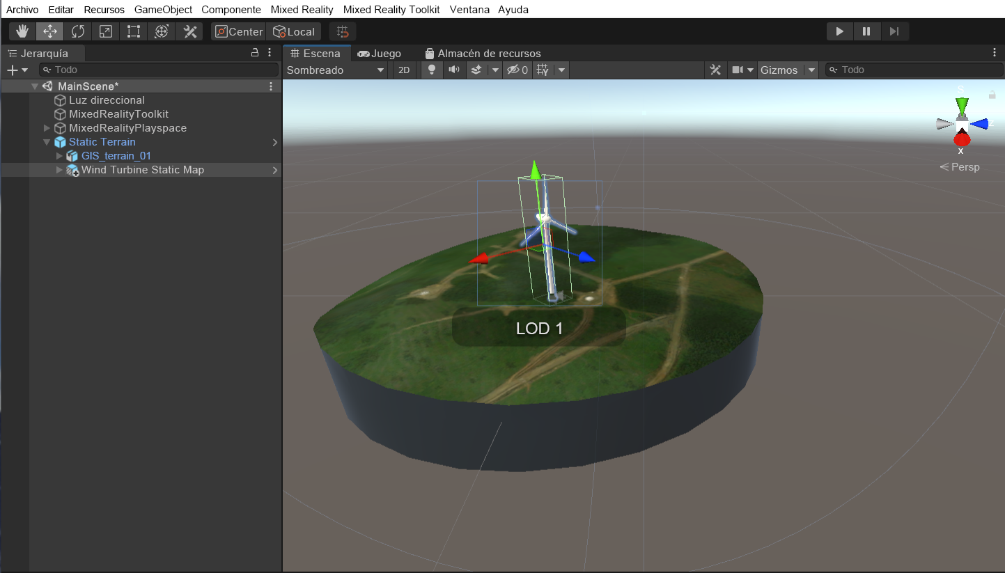 Captura de pantalla de la ventana de la escena de Unity con la escena principal en ejecución y el objeto secundario de mapa estático de turbina eólica y la herramienta de escala resaltados.