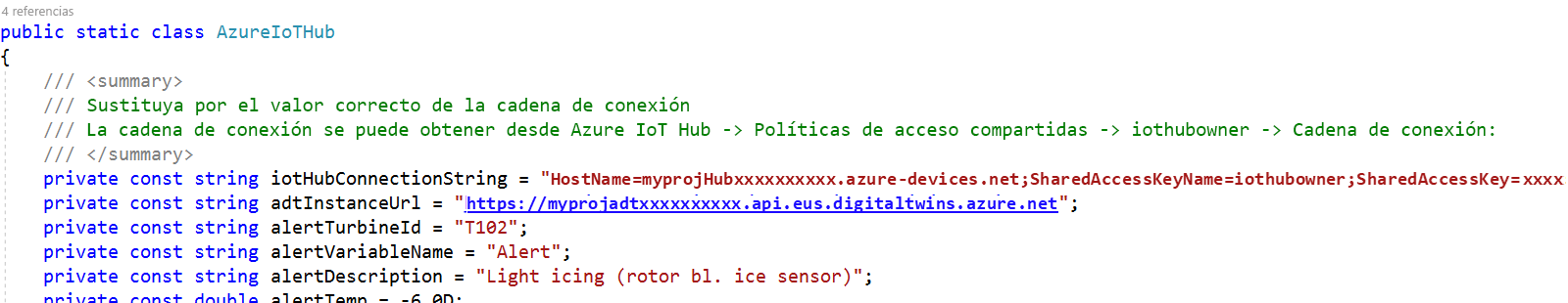 Recorte de pantalla de la solución Device Simulator con el archivo cs de Azure IoT Hub abierto y los valores de dirección URL de instancia y nombre de host agregados.