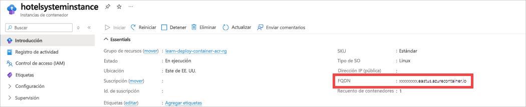 Captura de pantalla en la que se muestra el panel Nuevos de Azure Portal con las propiedades de contenedor con el FQDN resaltado.