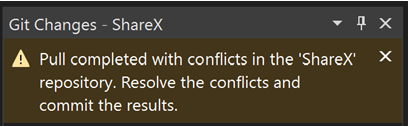 Captura de pantalla de una notificación de conflicto de fusión mediante combinación.