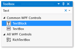 Captura de pantalla de la ventana Cuadro de herramientas con el control TextBlock seleccionado en la lista de controles comunes de WPF.