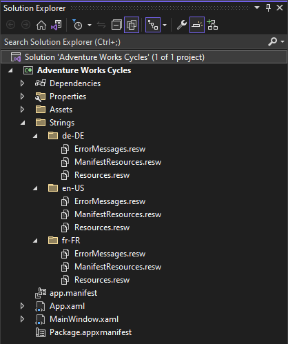 Screenshot of the Solution panel showing the Adventure Works Cycles > Strings folder with German, U S English, and French locale folders and files.