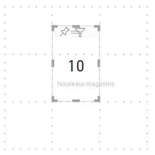 Capture d’écran du canevas du rapport montrant comment le quadrillage et l’alignement sur la grille permettent d’aligner correctement les visuels inclus dans vos rapports.