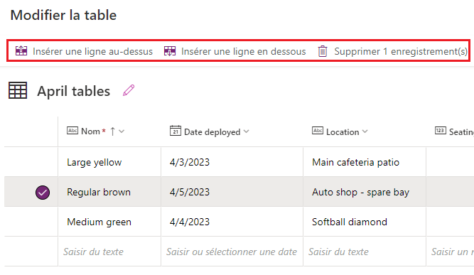 Capture d’écran d’une ligne de table déjà saisie sélectionnée, avec les nouveaux boutons Insérer une ligne au-dessus, Insérer une ligne en dessous et Supprimer l’enregistrement mis en évidence. 