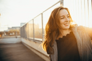 A woman on the roof of an apartment building