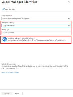 A screenshot showing how to use the select managed identities dialog to filter and select the managed identity to assign the role to.