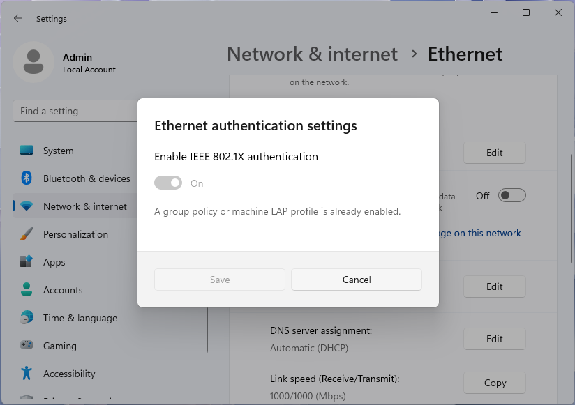 Снимок экрана: диалоговое окно параметров проверки подлинности Ethernet, отключено групповой политикой в приложении параметров Windows 11.