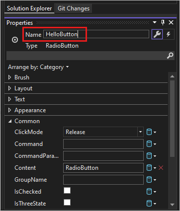 Screenshot showing the Solution Explorer Properties window for the 'HelloButton' RadioButton.